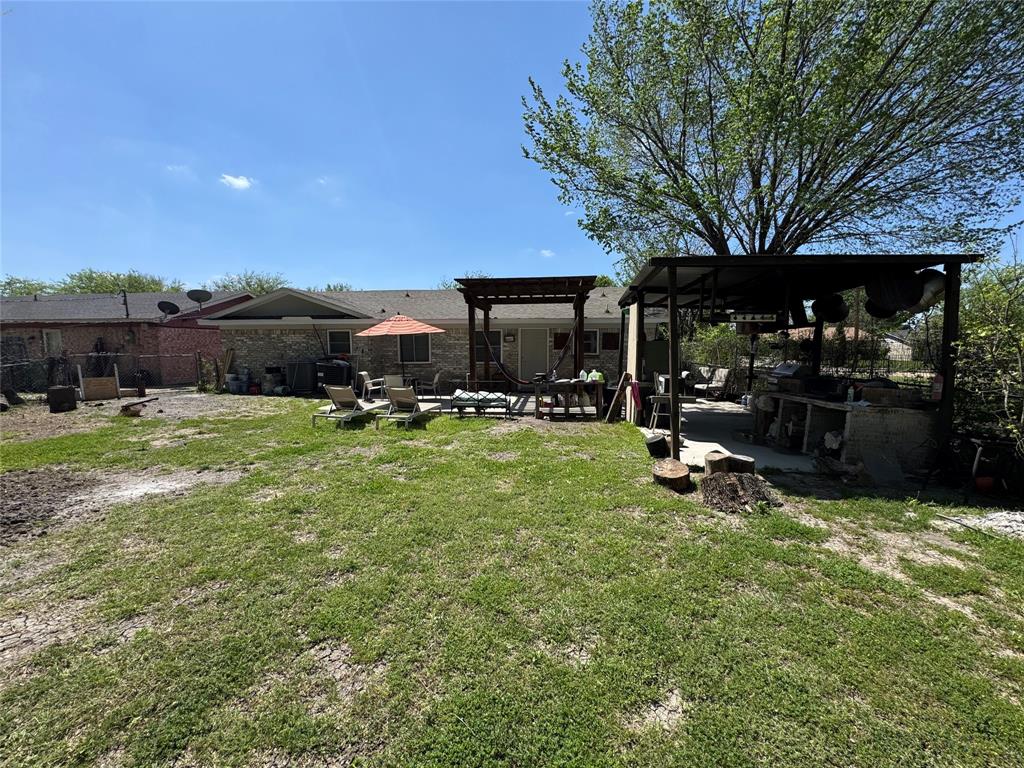 320 Pecan Street Wilmer, TX 75172 - Photo 21 of 25 Fenced yard with a patio area and a pergola