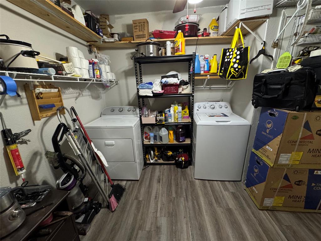 320 Pecan Street Wilmer, TX 75172 - Photo 9 of 25 Storage area with a ceiling fan and independent washer and dryer