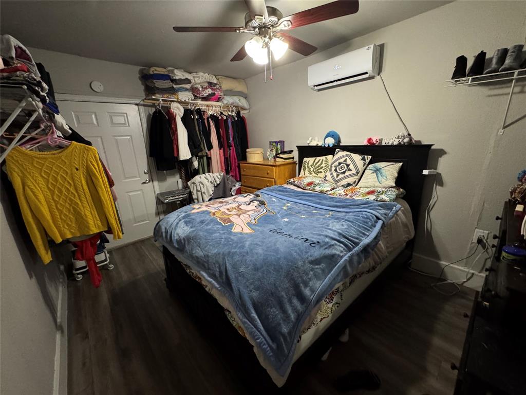320 Pecan Street Wilmer, TX 75172 - Photo 10 of 25 Bedroom with a closet, dark wood-type flooring, and ceiling fan