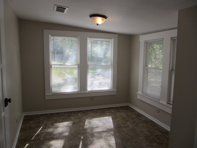 3002 Montgomery Road Huntsville, TX 77340 - Photo 11 of 27 an empty room with windows