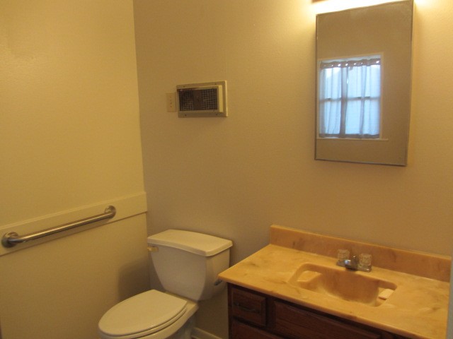 3002 Montgomery Road Huntsville, TX 77340 - Photo 19 of 27 a bathroom with a sink and a toilet