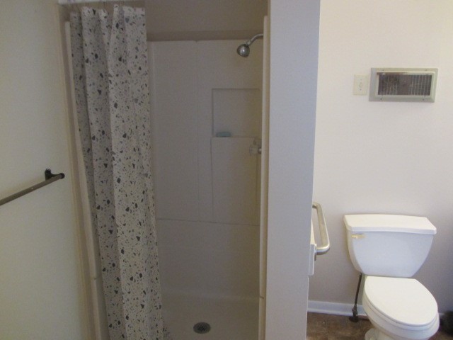 3002 Montgomery Road Huntsville, TX 77340 - Photo 20 of 27 a bathroom with a toilet and a shower