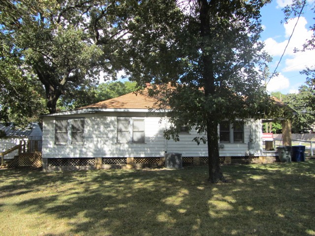 3002 Montgomery Road Huntsville, TX 77340 - Photo 25 of 27 a view of a house with a yard balcony and tree