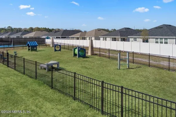 a view of a garden with an outdoor seating