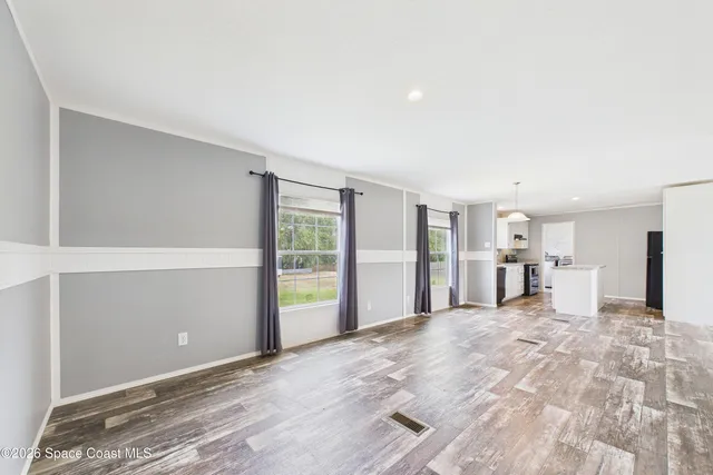 a view of a livingroom with a dinning table and chair