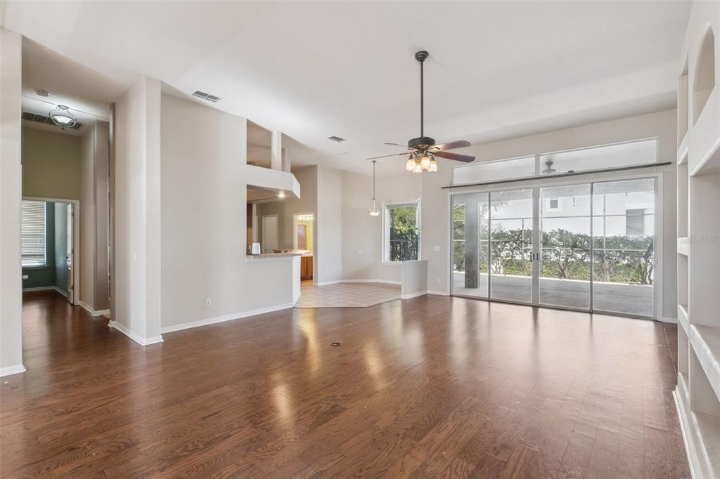 774 Lancer Circle Ocoee, FL 34761 - Photo 7 of 35 a view of an empty room with wooden floor and a window