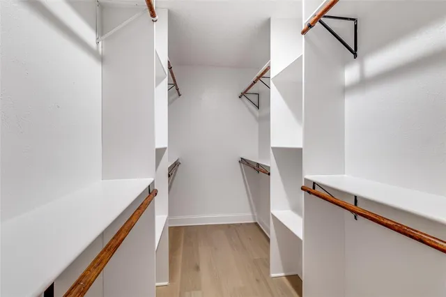 a view of entryway with stairs and wooden floor