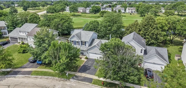 an aerial view of house with yard