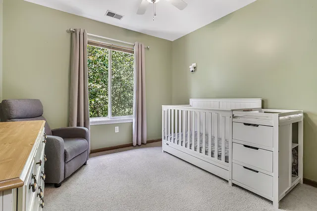 a bedroom with furniture and a window