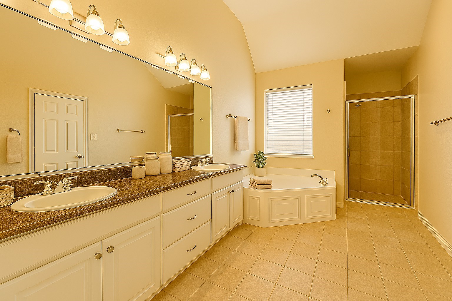 2423 Ralph Street Houston, TX 77006 - Photo 16 of 32 The home offers 3 full bathrooms and one half bath, including a primary bath with elevated features such as a jetted tub, double sinks, and separate shower. Finishes throughout reflect a modern and updated style, contributing to a move-in-ready condition.