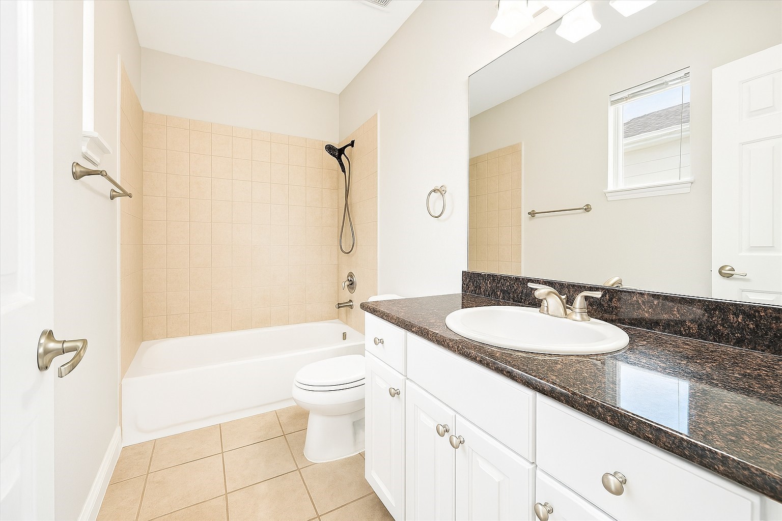 2423 Ralph Street Houston, TX 77006 - Photo 25 of 32 a bathroom with a granite countertop sink toilet mirror and bathtub