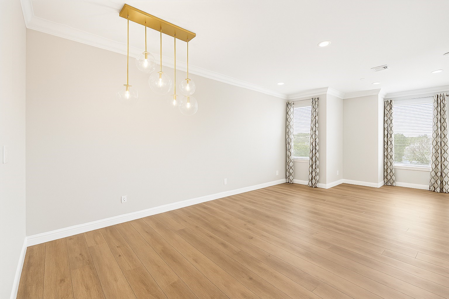 2423 Ralph Street Houston, TX 77006 - Photo 7 of 32 a view of an empty room with wooden floor and windows