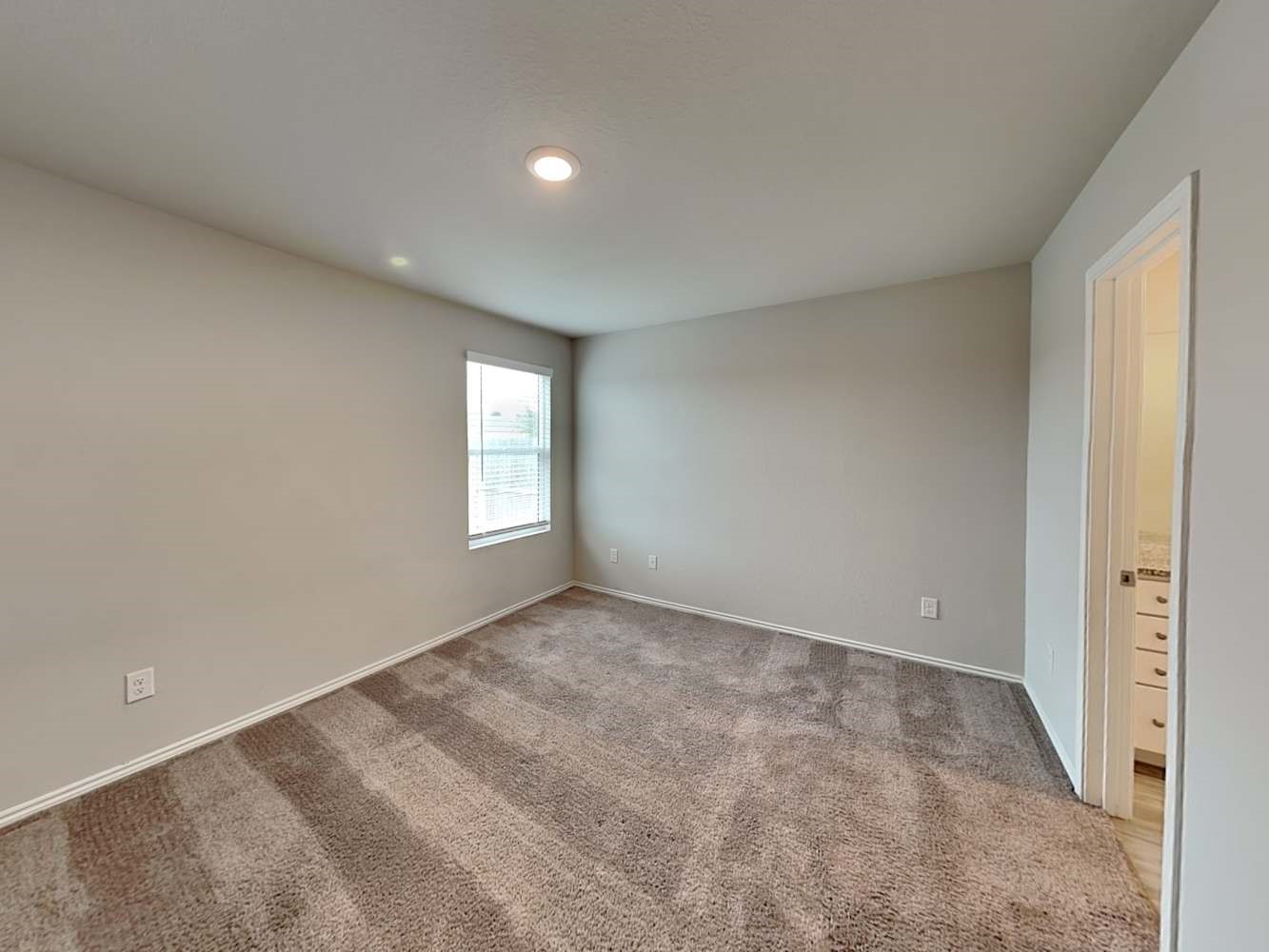 7322 Adaja River San Antonio, TX 78244 - Photo 7 of 17 a view of an empty room and window
