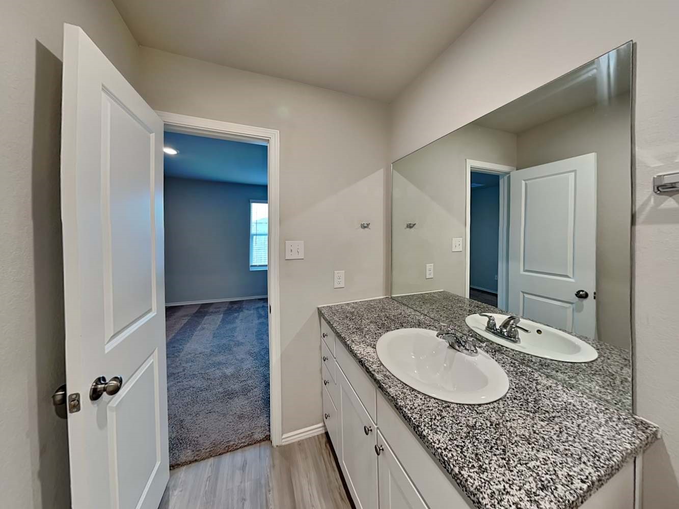 7322 Adaja River San Antonio, TX 78244 - Photo 8 of 17 a bathroom with a granite countertop sink and a mirror