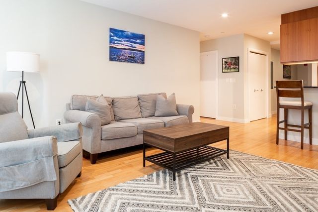 a living room with furniture and a table