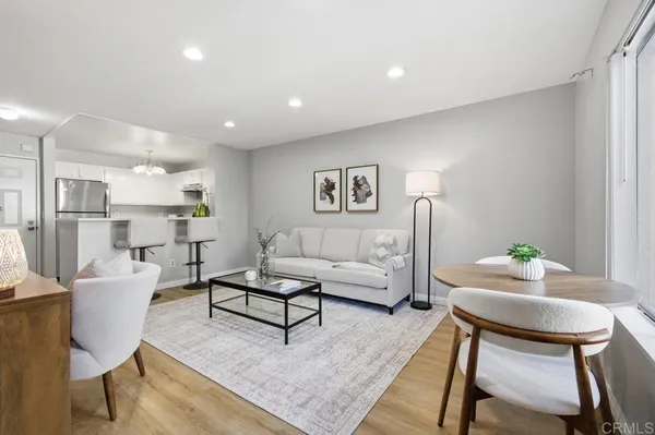 a living room with furniture and a table