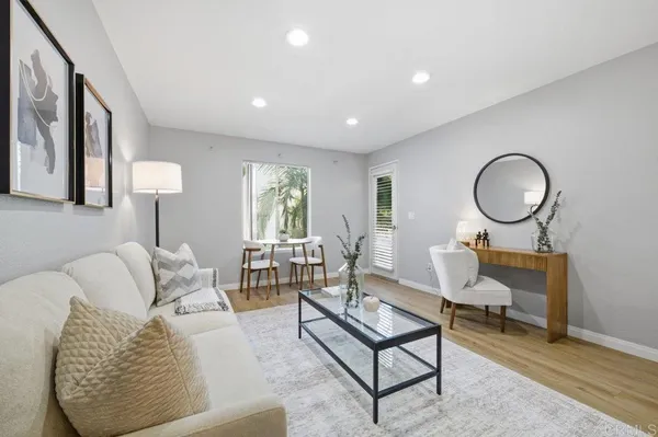 a living room with furniture and a window