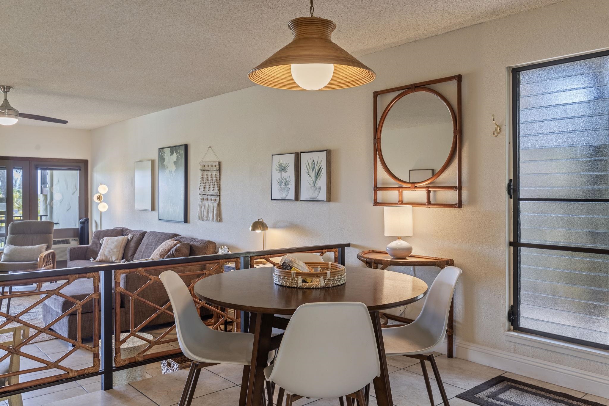 2881 South Kihei Road, Unit 59 Kihei, HI 96753 - Photo 12 of 37 a view of a dining room with furniture and chandelier