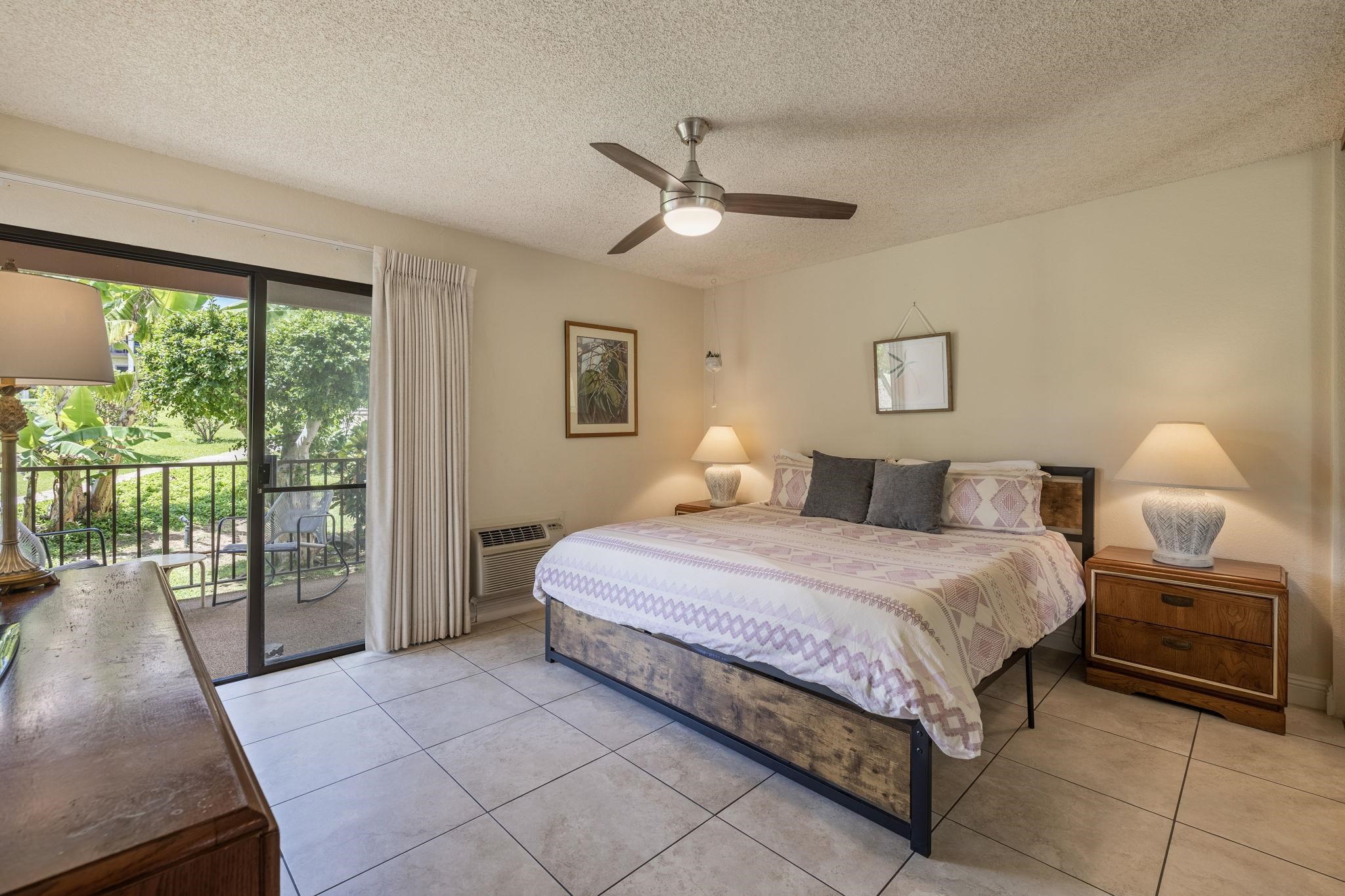 2881 South Kihei Road, Unit 59 Kihei, HI 96753 - Photo 13 of 37 a bedroom with a bed and glass window
