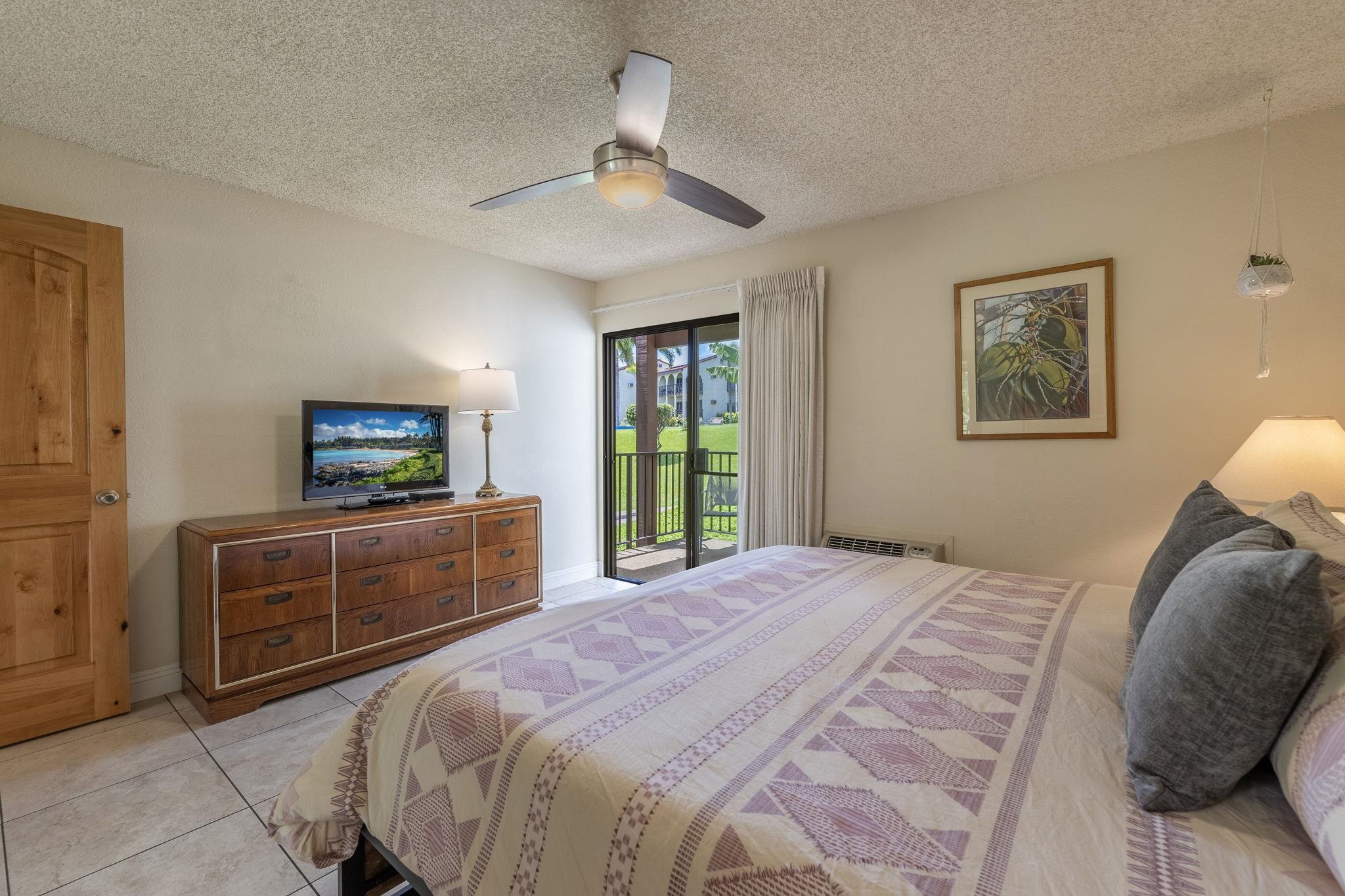 2881 South Kihei Road, Unit 59 Kihei, HI 96753 - Photo 14 of 37 a bedroom with a bed and a dresser
