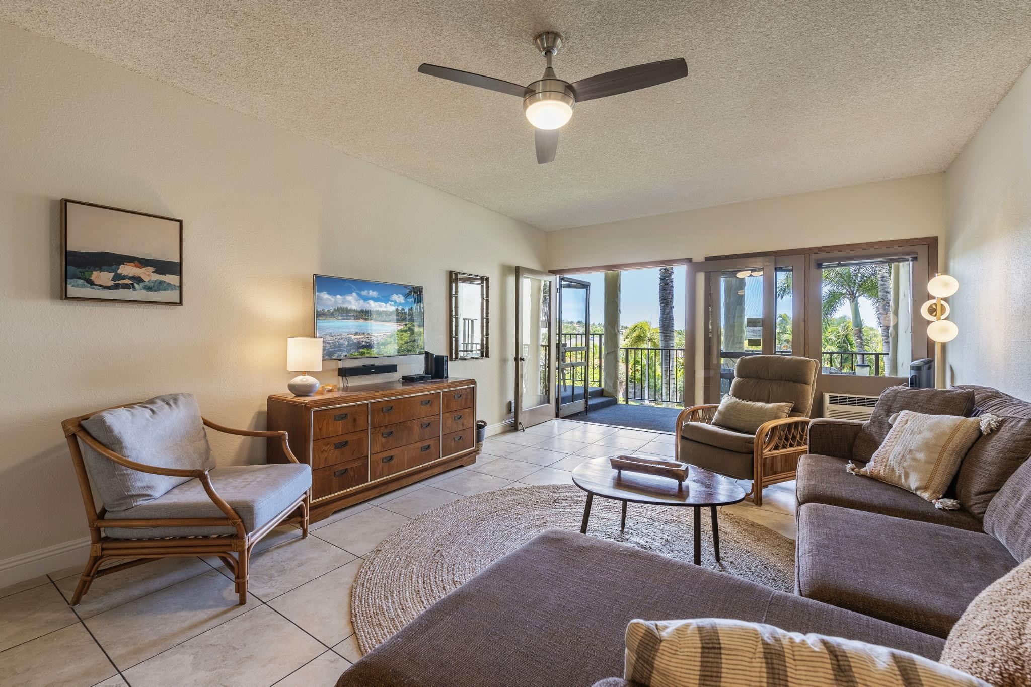 2881 South Kihei Road, Unit 59 Kihei, HI 96753 - Photo 2 of 37 a living room with furniture and a large window