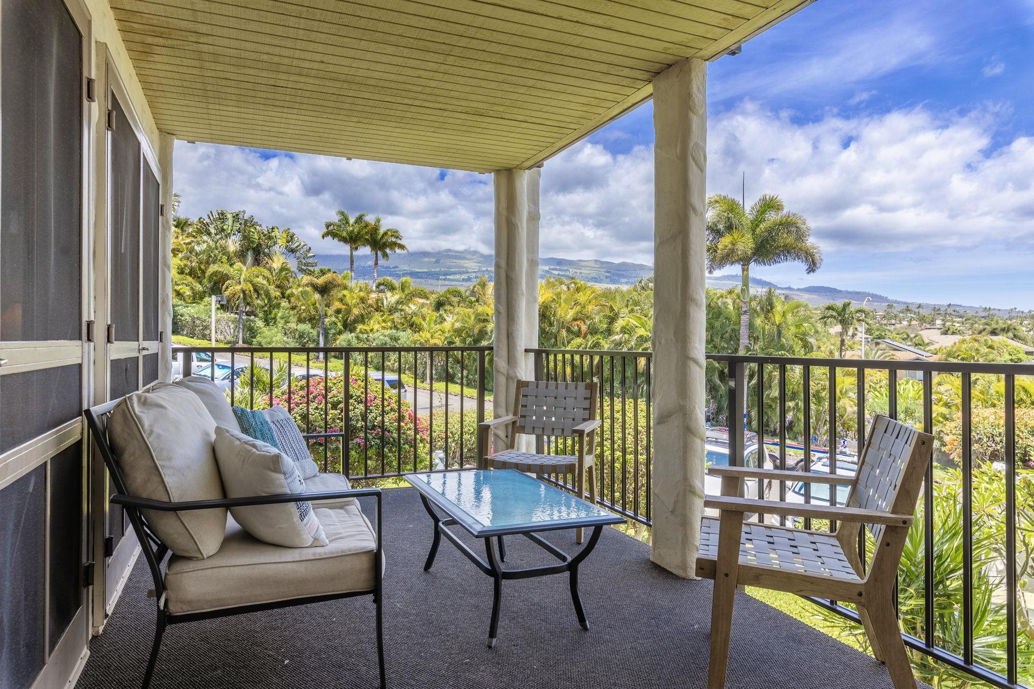 2881 South Kihei Road, Unit 59 Kihei, HI 96753 - Photo 27 of 37 a balcony with wooden floor table and chairs