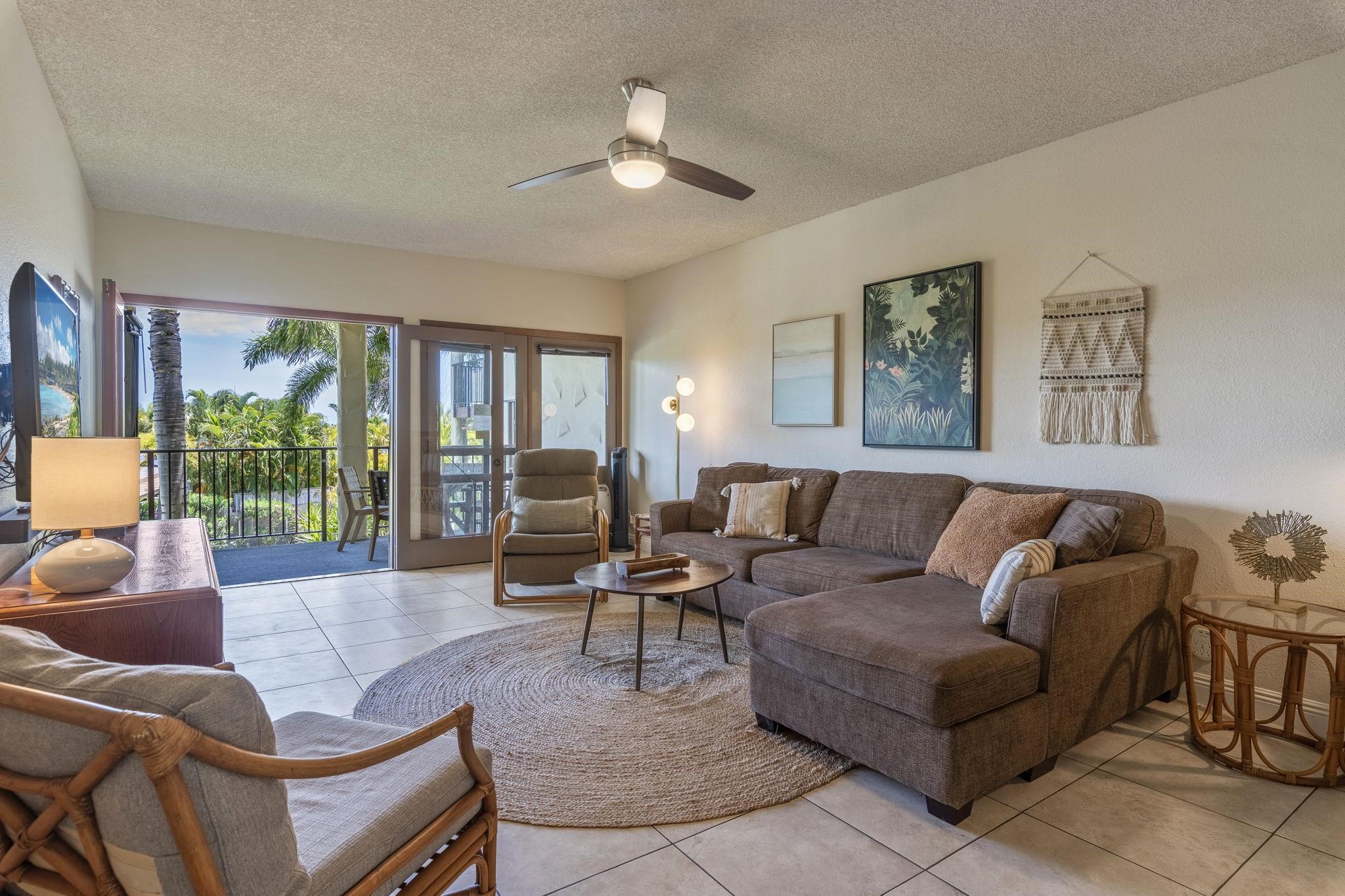 2881 South Kihei Road, Unit 59 Kihei, HI 96753 - Photo 4 of 37 a living room with furniture and a large window