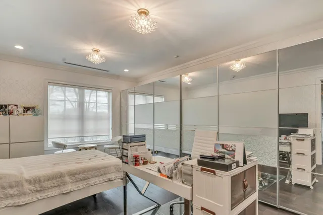 a room with a bed a table and chairs