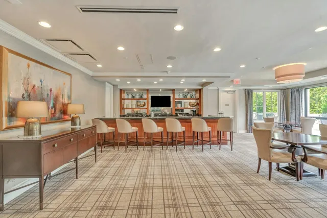 a living room with lots of furniture and a table