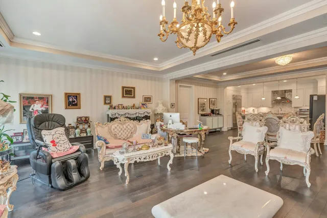 a living room with furniture or wooden floor and a chandelier