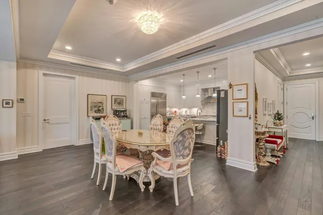 a dining room with furniture and wooden floor