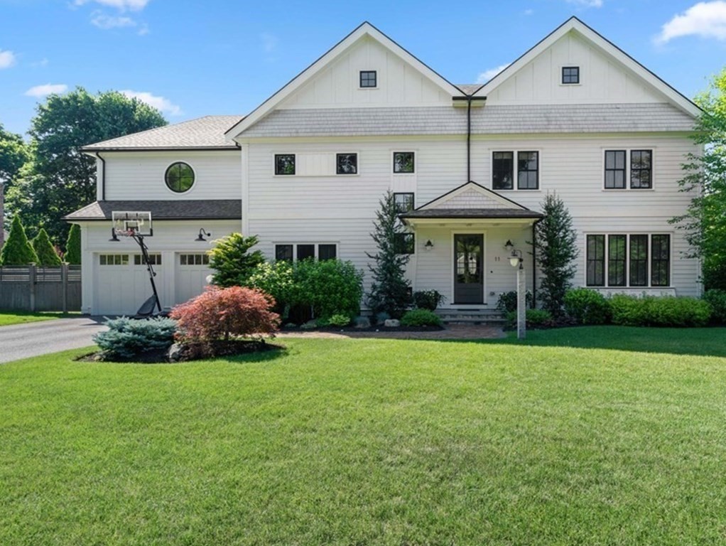 11 Fisher Avenue Wellesley, MA 02482 - Photo 1 of 1 a front view of a house with a garden and plants