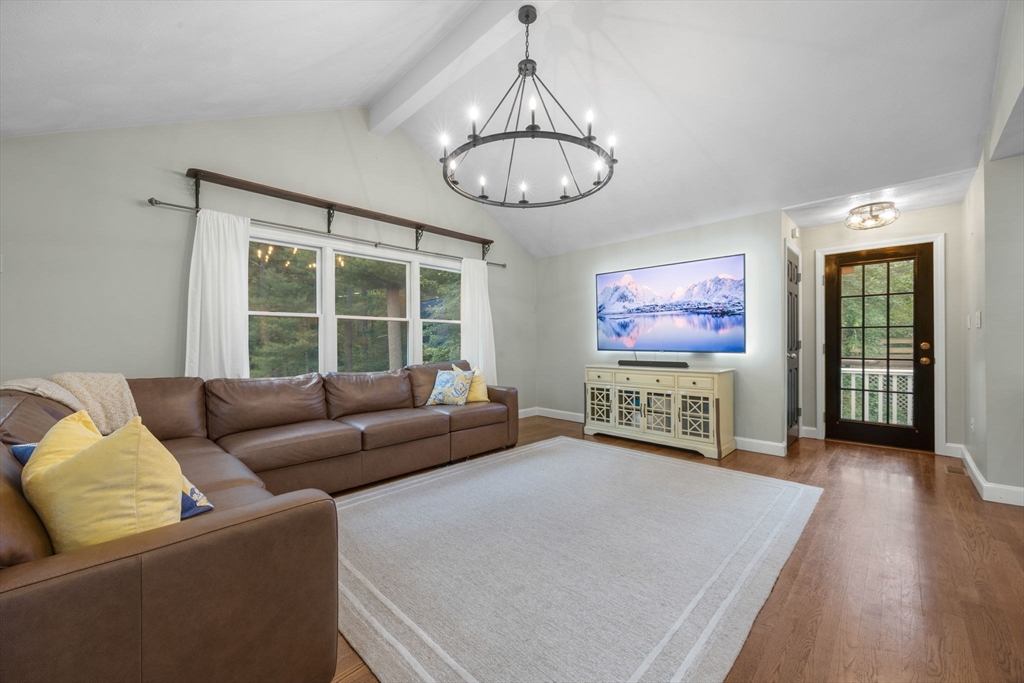 175 Central Street North Reading, MA 01864 - Photo 11 of 42 a living room with furniture a window and a flat screen tv