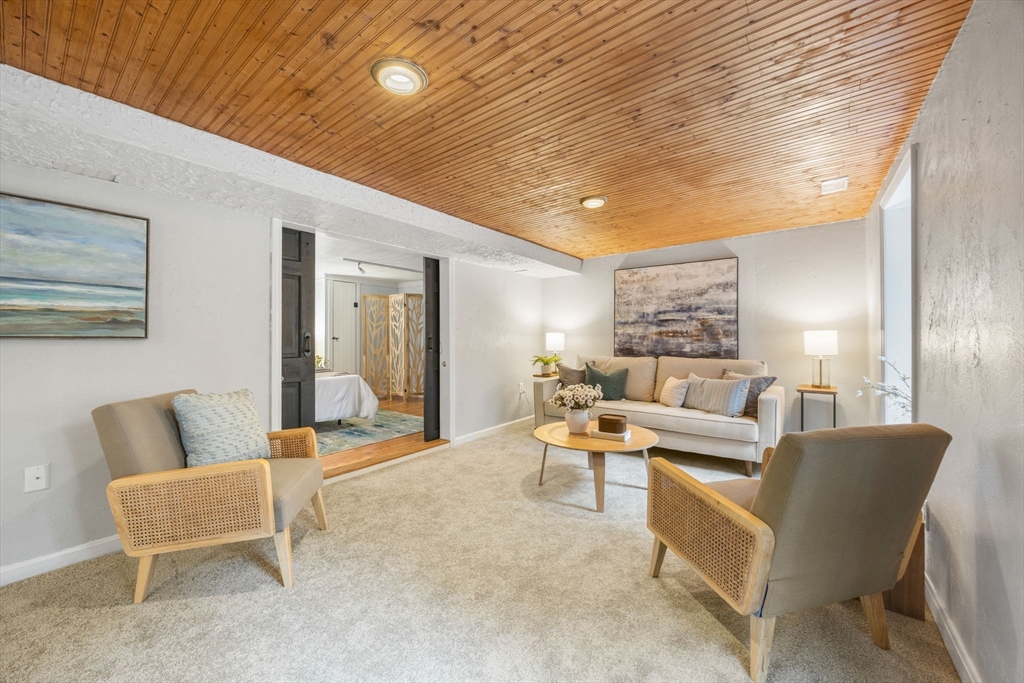 175 Central Street North Reading, MA 01864 - Photo 21 of 42 a living room with furniture and a large window