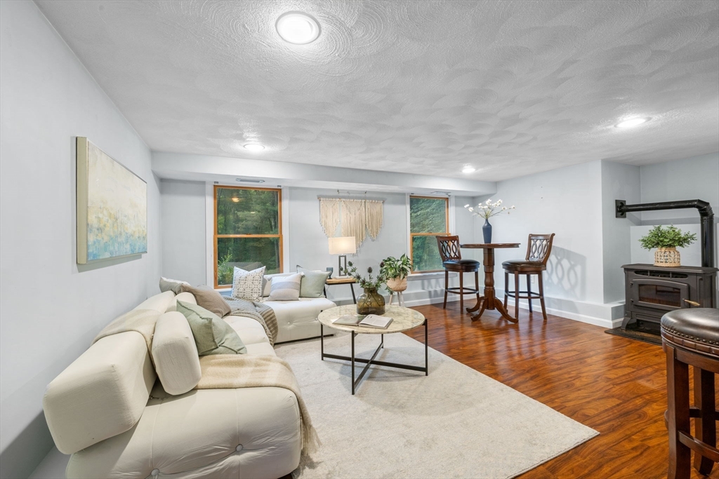 175 Central Street North Reading, MA 01864 - Photo 26 of 42 a living room with furniture wooden floor and a large window