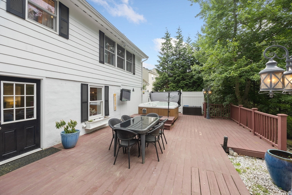 175 Central Street North Reading, MA 01864 - Photo 30 of 42 a view of a dinning table and chairs in patio of the house