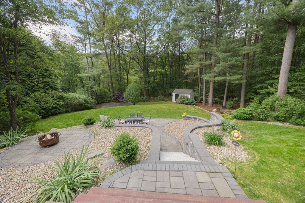 175 Central Street North Reading, MA 01864 - Photo 32 of 42 a view of a garden with a bench