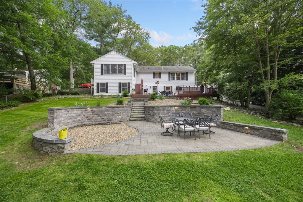175 Central Street North Reading, MA 01864 - Photo 34 of 42 a front view of a house with a yard table and chairs
