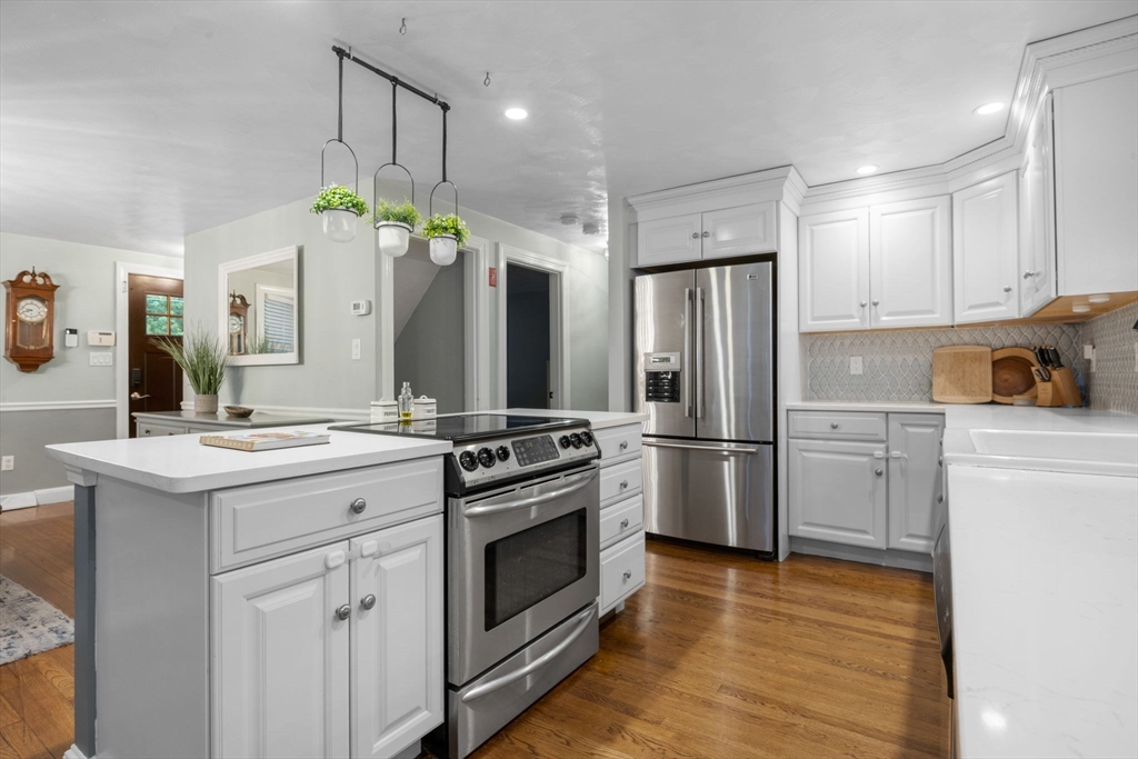 175 Central Street North Reading, MA 01864 - Photo 7 of 42 a kitchen with a sink stove and refrigerator