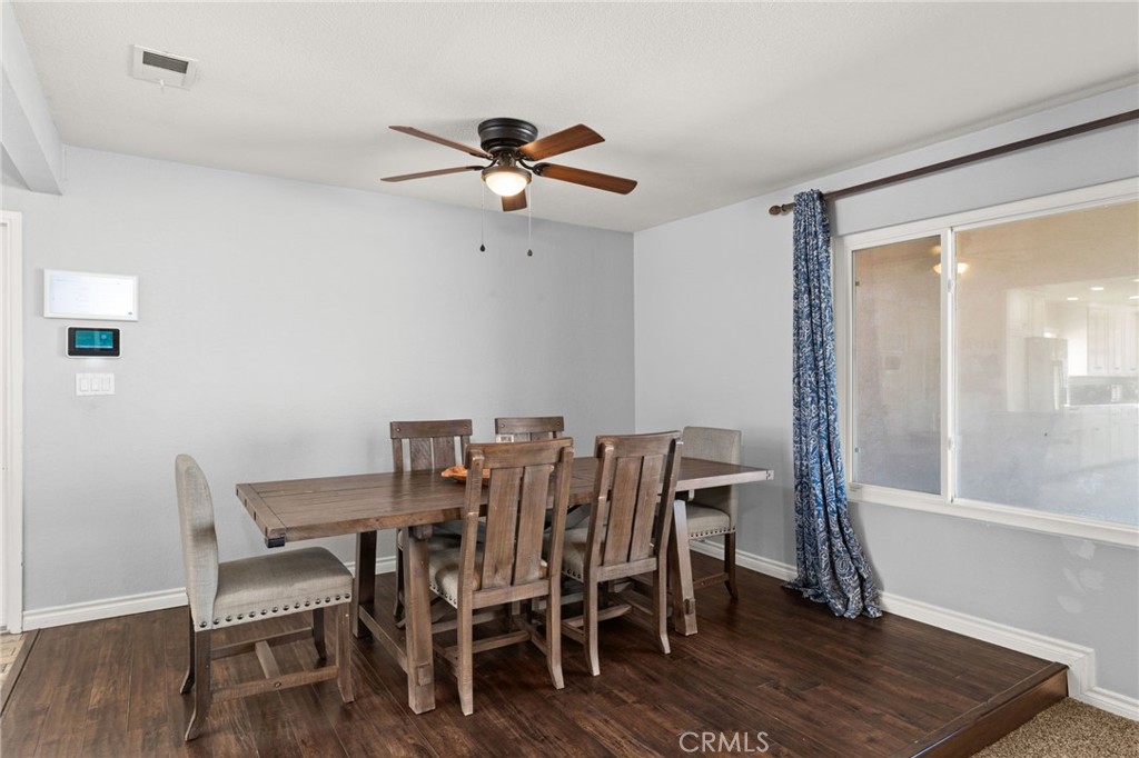 18165 Mariposa Avenue Riverside, CA 92508 - Photo 14 of 59 a view of a dining room with furniture and a window