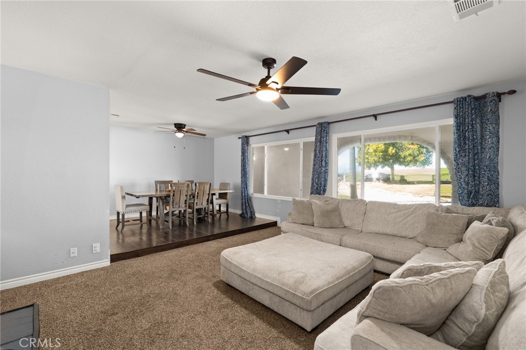 18165 Mariposa Avenue Riverside, CA 92508 - Photo 16 of 59 a living room with furniture and a large window