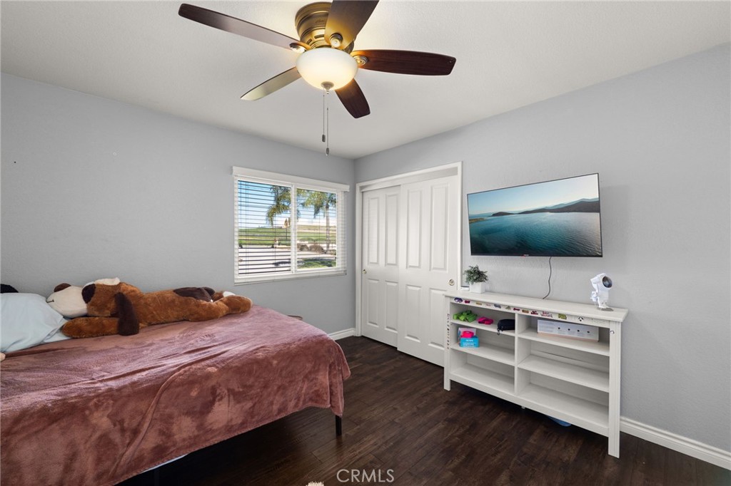 18165 Mariposa Avenue Riverside, CA 92508 - Photo 19 of 59 a bedroom with a bed and a flat screen tv
