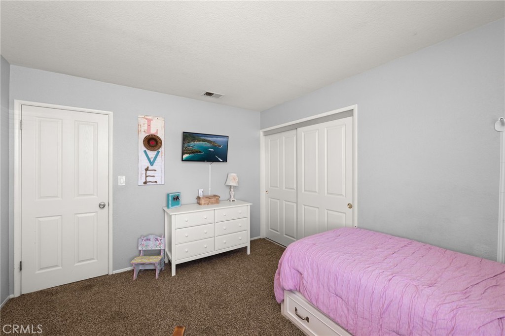 18165 Mariposa Avenue Riverside, CA 92508 - Photo 23 of 59 a bedroom with two beds and a window