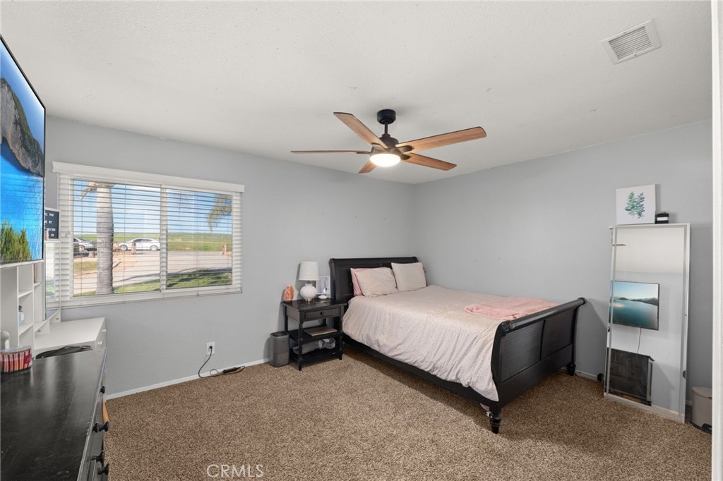 18165 Mariposa Avenue Riverside, CA 92508 - Photo 24 of 59 a bedroom with a bed and window
