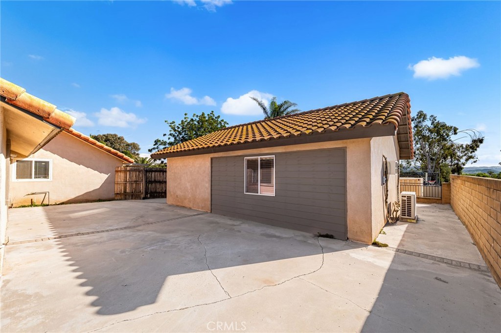 18165 Mariposa Avenue Riverside, CA 92508 - Photo 31 of 59 a view of a house with a patio