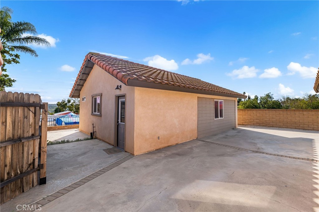 18165 Mariposa Avenue Riverside, CA 92508 - Photo 32 of 59 a view of a house with a yard