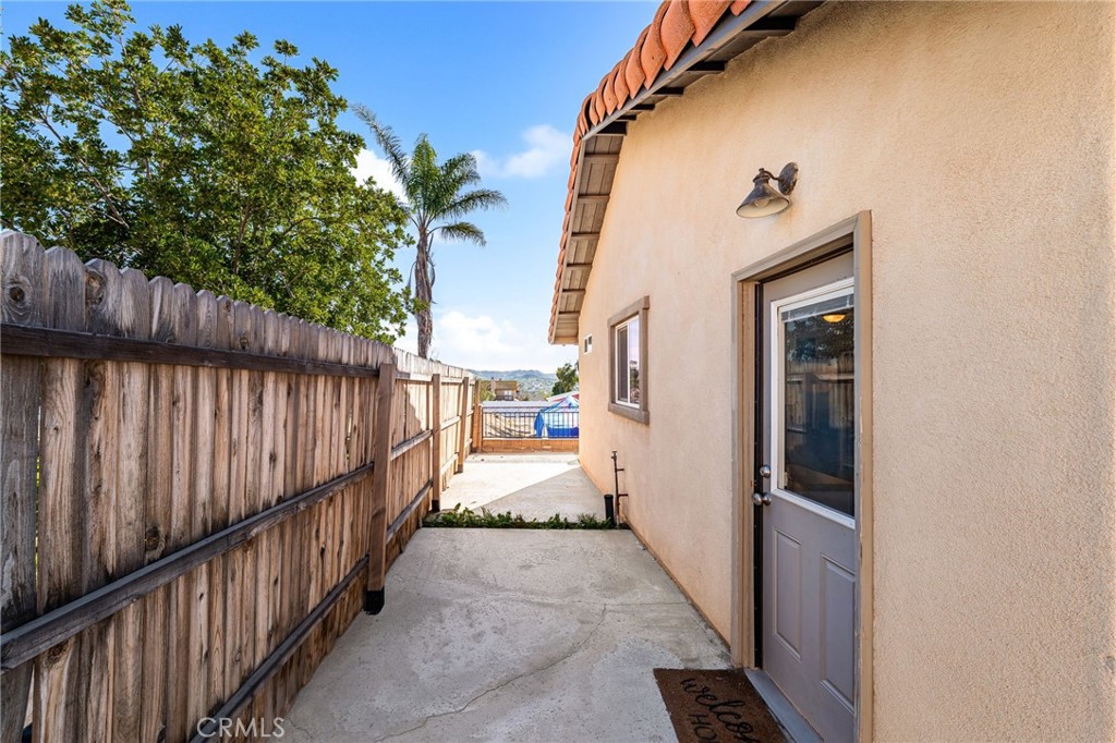 18165 Mariposa Avenue Riverside, CA 92508 - Photo 33 of 59 a view of a pathway of a house with wooden fence