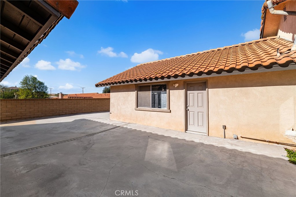 18165 Mariposa Avenue Riverside, CA 92508 - Photo 34 of 59 a view of a house with a backyard