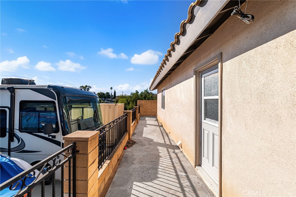 18165 Mariposa Avenue Riverside, CA 92508 - Photo 35 of 59 a view of a balcony with wooden floor and stairs