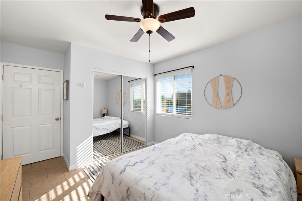 18165 Mariposa Avenue Riverside, CA 92508 - Photo 44 of 59 a bedroom with a bed and a chandelier